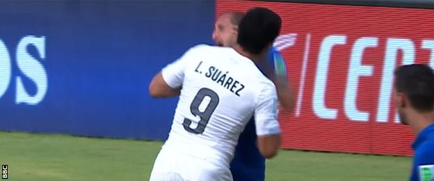 Luis Suarez appears to bite Giergio Chiellini