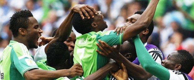 Ahmed Musa (centre) celebrates his second goal