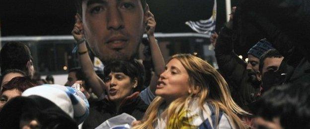 Fans wait for Luis Suarez at Carrasco International Airport near Montevideo