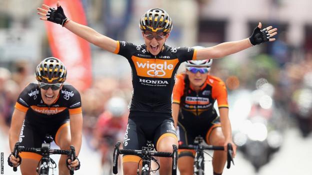 Laura Trott celebrates as she crosses the finish line to win the Elite Women British National road race championships in Abergavenny
