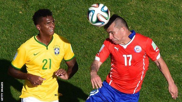 Gary Medel heads the ball during Chile's World Cup match against Brazil