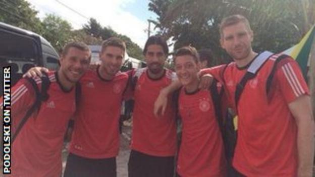 Lukas Podolski (left) and some of his Germany team-mates on their way to Belo Horizonte to play Brazil