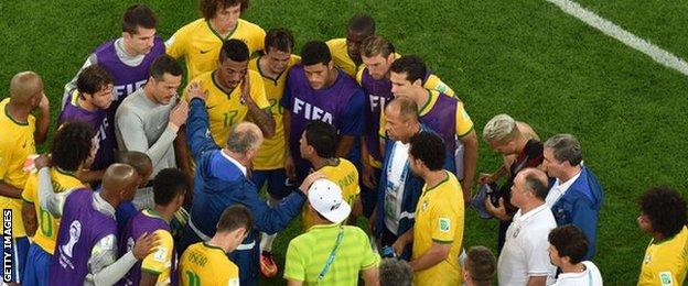Luiz Felipe Scolari tried to console his devastated players after their record World Cup defeat