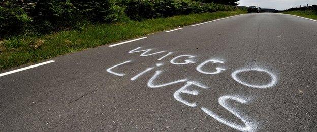 Wiggo Lives is written on the tarmac of a road