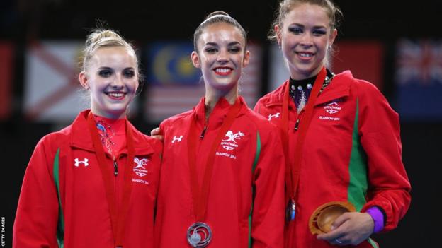 Nikara Jenkins, Laura Halford and Frankie Jones won Wales' first medal of the 2014 Commonwealth Games with a team silver in rhythmic gymnastics.
