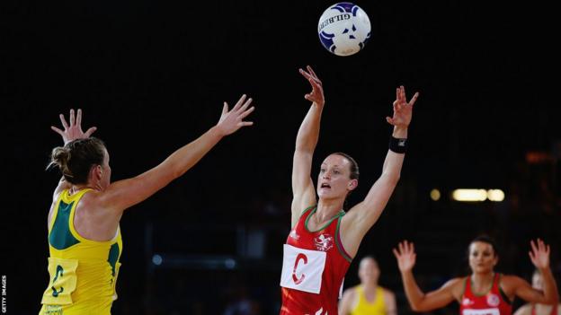 Wales' netball team were beaten 63-26 by Australia in their opening game in Glasgow.