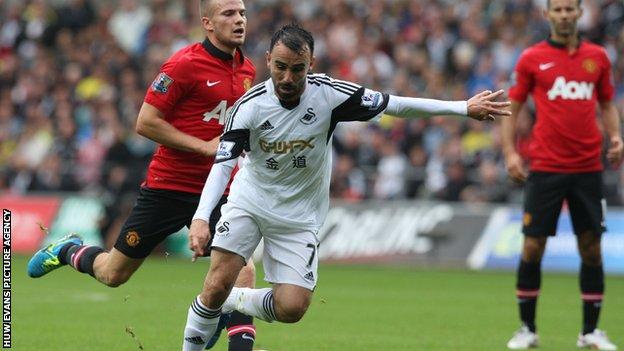 Leon Britton in action against Manchester United