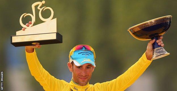 Vincenzo Nibali of Italy and Astana Pro Team celebrates victory in the yellow jersey on the podium