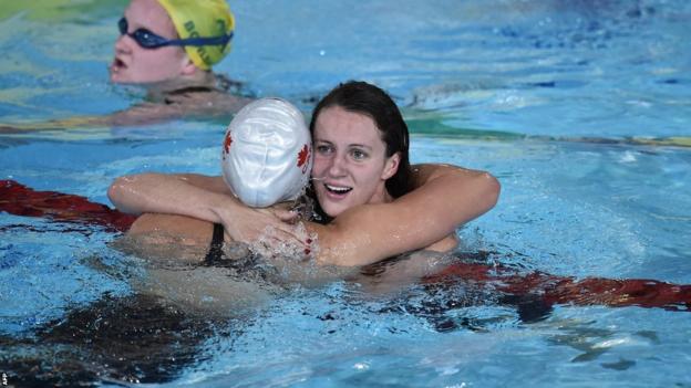 Jazz Carlin is congratulated by Canada's silver medallist Brittany Maclean after winning gold in the 800m freestyle.
