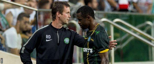 Ronny Deila consoles Efe Ambrose after his red card against Legia Warsaw.