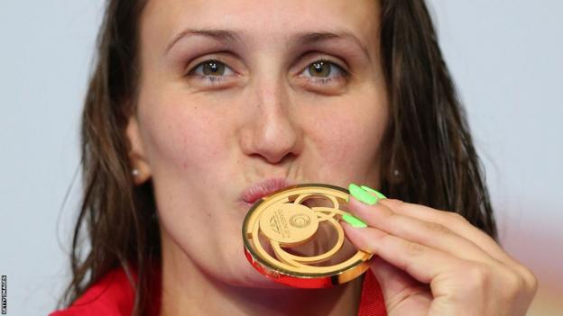 Georgia Davies won Wales' second gold medal at the swimming pool with victory in the 50m backstroke final.