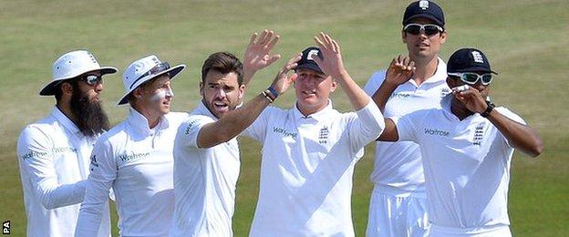 England celebrate a wicket against India