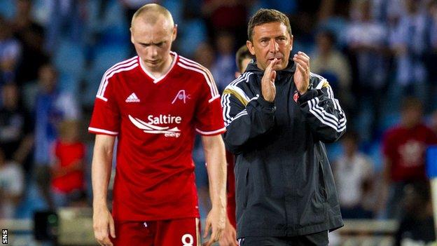 Derek McInnes (right) acknowledges the Aberdeen fans after defeat against Real Sociedad
