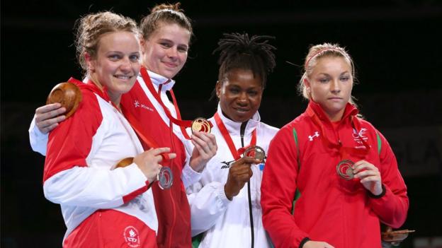 Middleweight Lauren Price (right) made history as the first Welsh female boxer to win a medal at the Commonwealth Games, securing bronze.