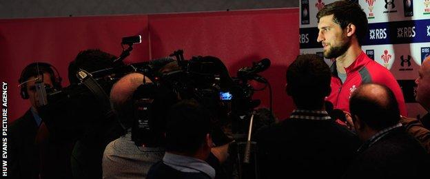 Luke Charteris faces a scrum of cameramen during a Wales media session