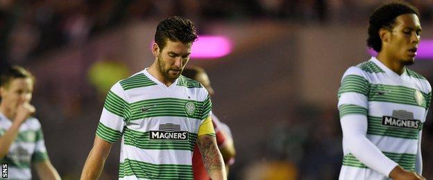 Charlie Mulgrew and Virgil van Dijk leave the field following Celtic's 2-0 defeat by Legia Warsaw