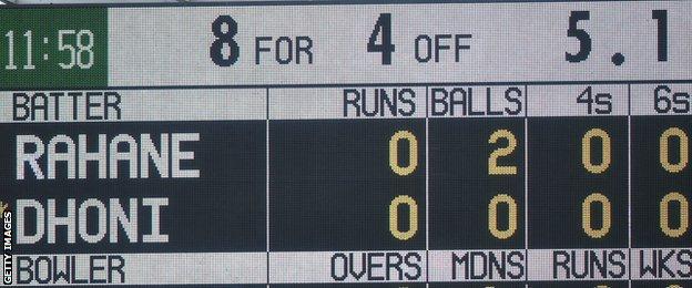 The Old Trafford scoreboard shows India 8-4