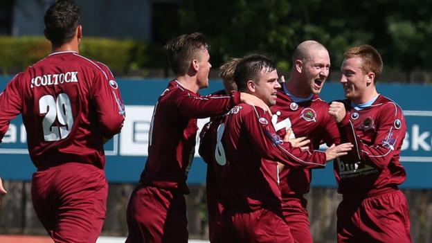 Institute celebrate a goal by Stephen O'Flynn as they marked their return to the Irish League's top flight with a 2-2 draw away to Dungannon Swifts