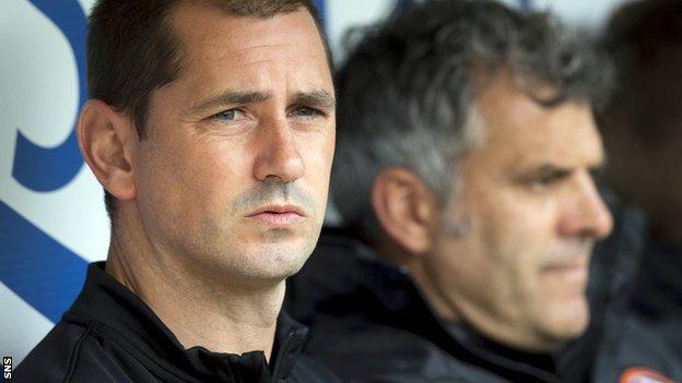 Dundee United manager Jackie McNamara watches on from the dugout as they defeat Aberdeen.