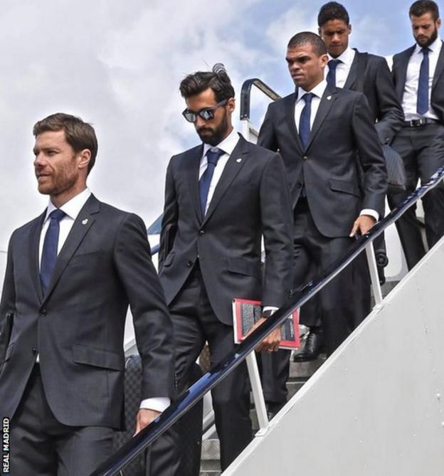 Real Madrid players, led by Xabi Alonso, set foot on Welsh soil at Cardiff Airport.