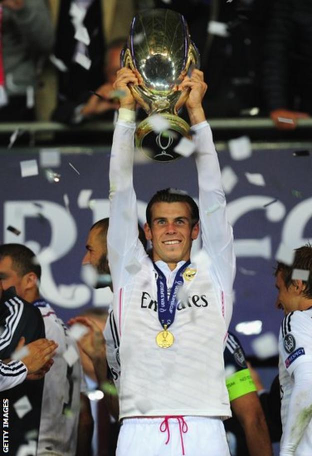 Gareth Bale holds aloft the Uefa Super Cup following Real Madrid's 2-0 win over Sevilla in Cardiff.