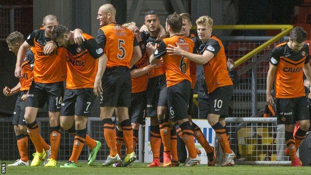 Dundee United players celebrate Mario Bilate's late strike against Motherwell.
