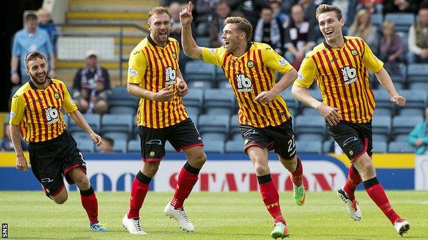 Partick Thistle ace Gary Fraser (2nd right) celebrates after giving his side the lead against Dundee.