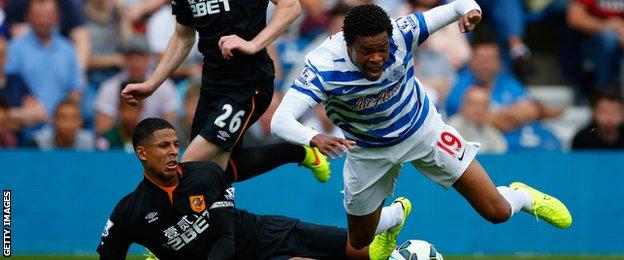 Loic Remy is tackled by Curtis Davies