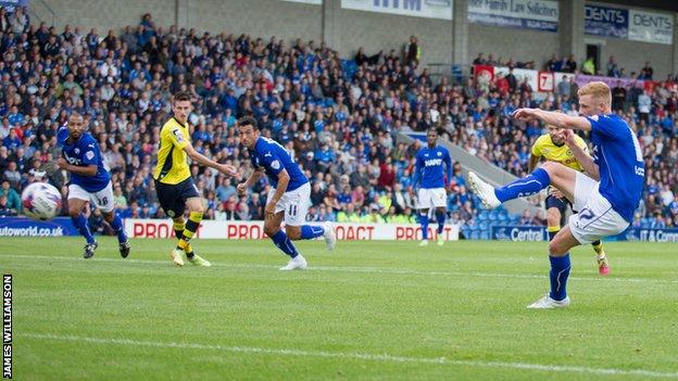 Chesterfield striker Eoin Doyle scores one of his two penalties against Rochdale