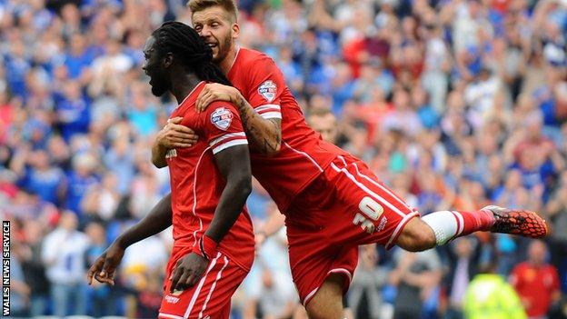 Kenwyne Jones and Guido Burgstaller celebrate