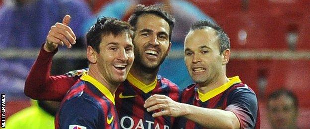 Cesc Fabregas, centre, with former Barcelona team-mates Lionel Messi (left) and Andres Iniesta