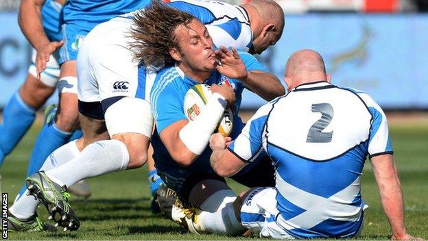 Italy's Josh Furno gets tackled during the Castle Larger Incoming Tour match between Italy and Scotland