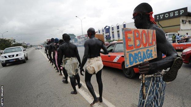 Members of the artist group ''Be Kok Spirit'' march to raise awareness on the Ebola virus