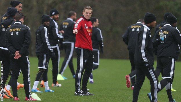 Garry Monk directs a Swansea City training session