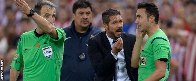 Atletico coach Diego Simeone (second right)