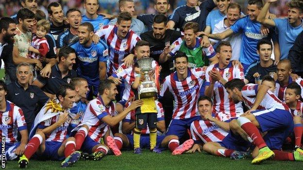 Atletico players celebrate their victory