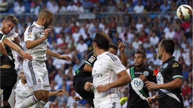 Real Madrid striker Karim Benzema heads in the opener