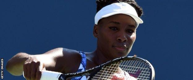 A bee lands on Venus Williams' racquet