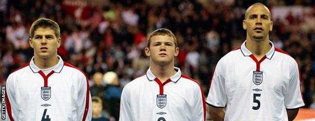 Wayne Rooney (centre) flanked by Steven Gerrard (left) and Rio Ferdinand