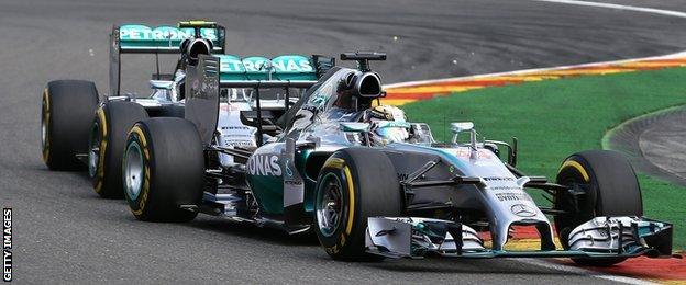 Nico Rosberg and Lewis Hamilton collide at the Belgian Grand Prix