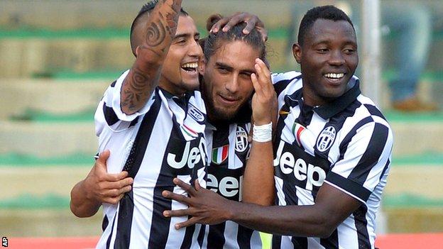 Arturo Vidal and Martin Caceres celebrate