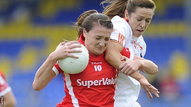 Cork's Annie Walsh is tackled by Armagh opponent Caroline O'Hanlon