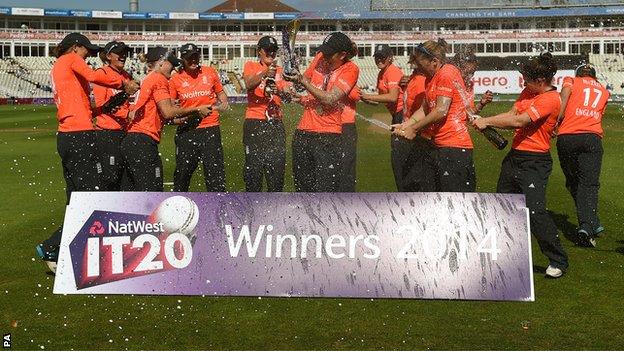 England spray each other with champagne after winning the T20 series