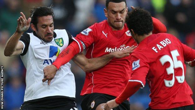 Steven Caulker and Jonas Gutierrez battle for the ball