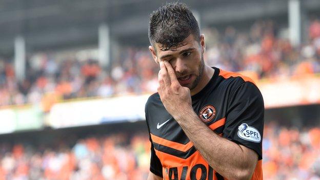 Dundee United's Nadir Ciftci is sent off after a second yellow for handling the ball.