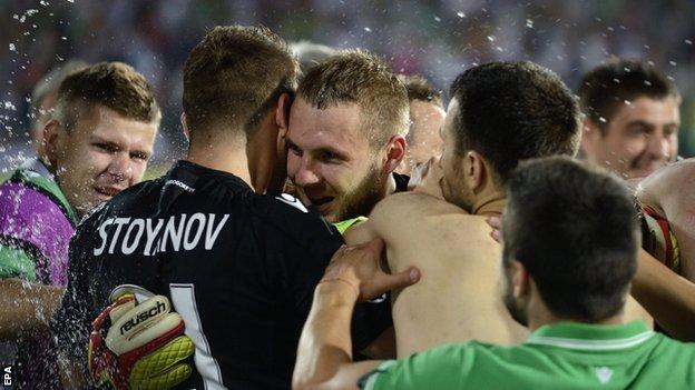 Cosmin Moti is congratulated by his team-mates