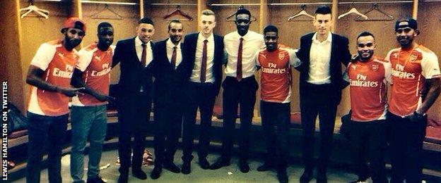 Lewis Hamilton (right) with various Arsenal players and guests at the London club's game against Manchester City