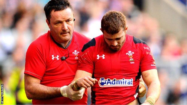 Leigh Halfpenny is helped off the field at Twickenham