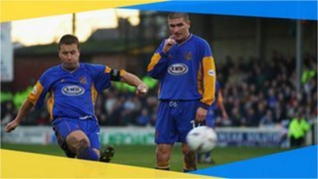 Shrewsbury's Nigel Jemson strikes his free-kick against Everton