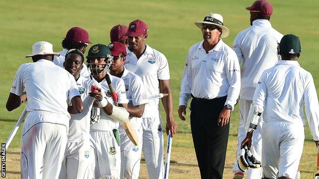 Bangladesh and West Indies players shake hands after the second Test